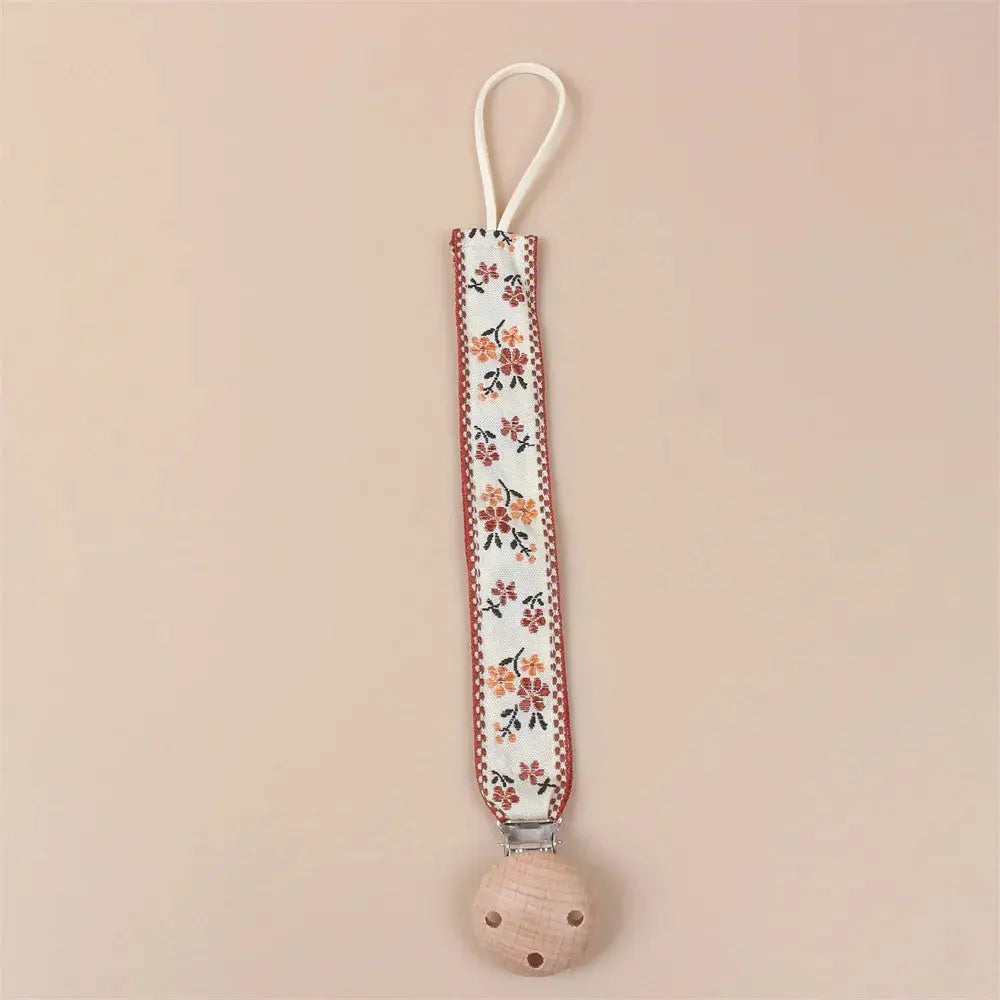 Attache tétine en tissu floral avec clip en bois