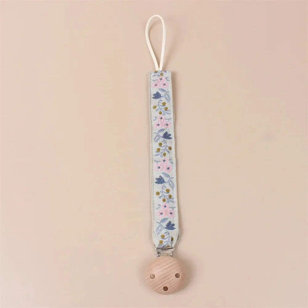 Attache tétine en tissu floral avec clip en bois