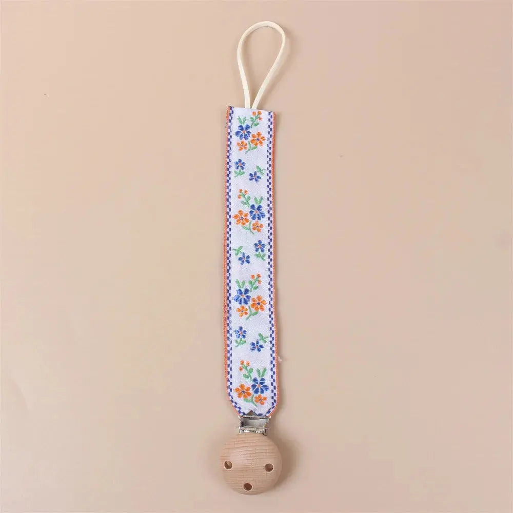 Attache tétine en tissu floral avec clip en bois